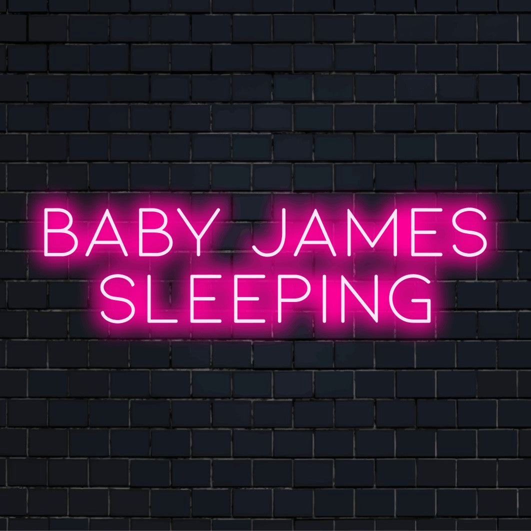 Baby James Sleeping Personalized LED Neon Sign, glowing neon text on black brick background