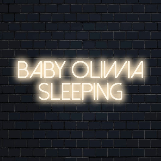 Baby Oliwia Sleeping Personalized LED Neon Sign, glowing neon text on dark brick background