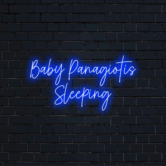 Baby Panagiotis Sleeping Personalized LED Neon Sign, bright neon lettering on black brick background