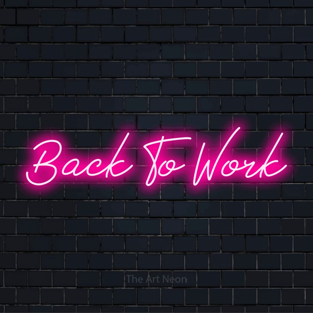 "Back To Work" LED neon sign on a black brick wall