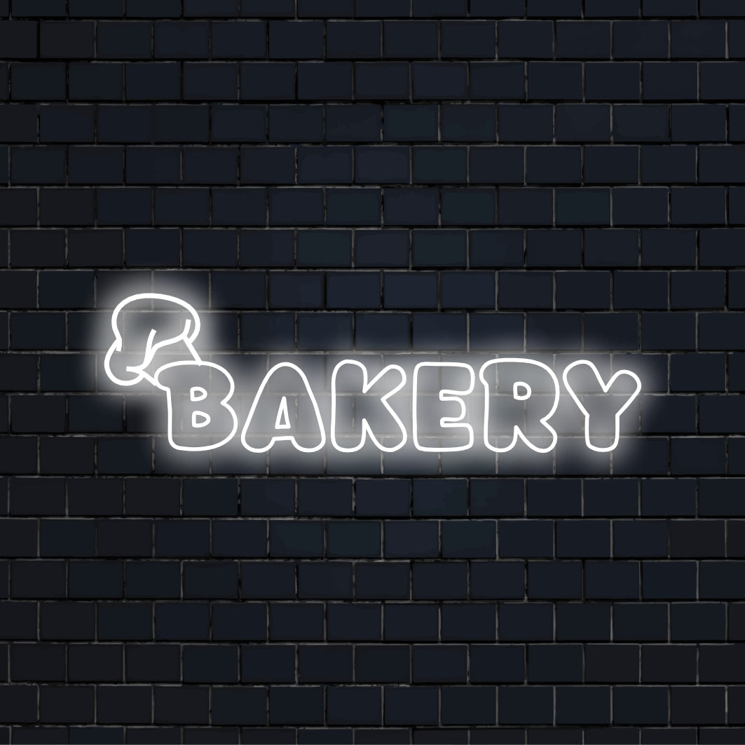 Bakery LED Neon Sign, bright neon lettering on dark brick background