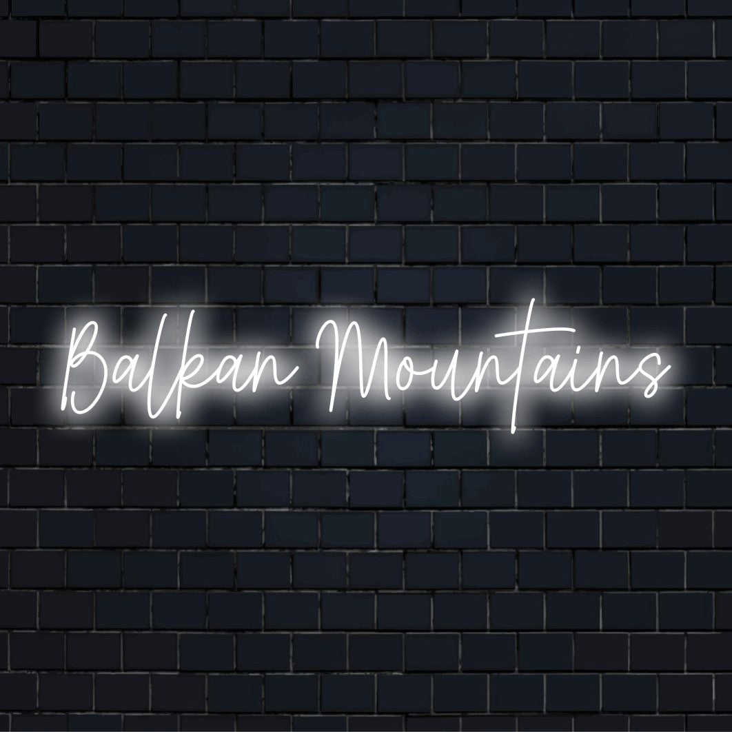 Balkan Mountains Neon Sign, bright neon lettering on dark brick wall