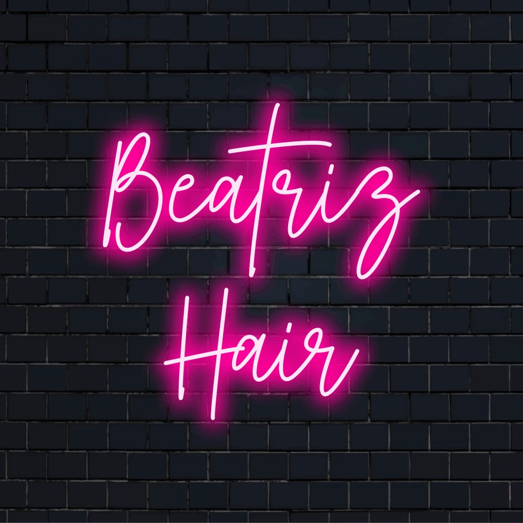 Beatriz Hair Personalized Neon Light with glowing wall decor against black brick wall