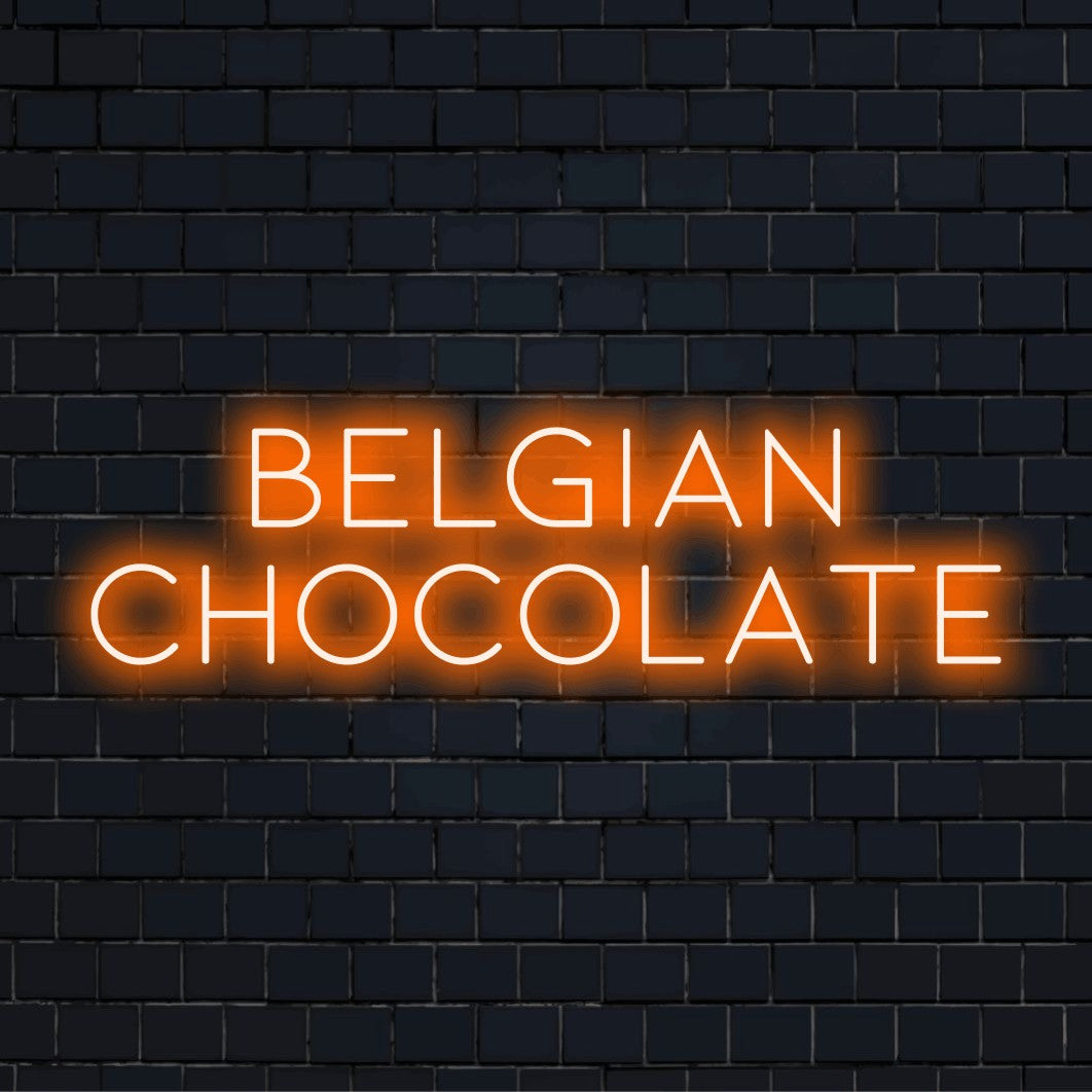 Belgian Chocolate LED Neon Sign, glowing lettering against black brick wall