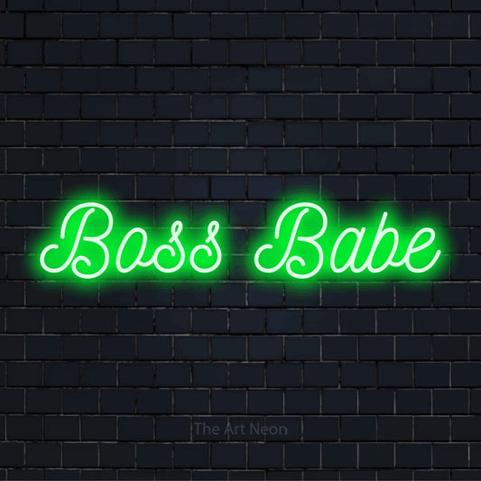 "Boss Babe" glowing LED neon sign on a black brick wall