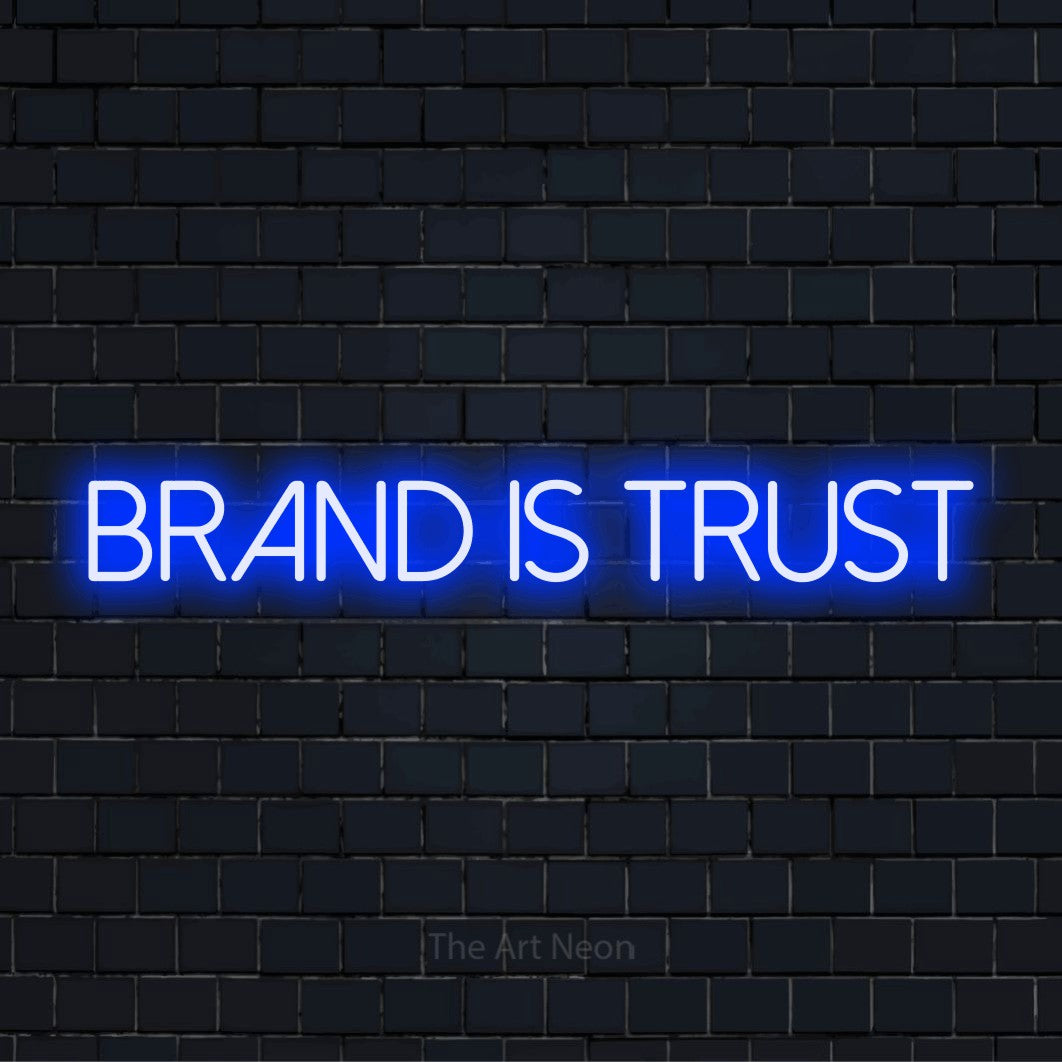 "Brand Is Trust" neon text design on a black brick wall
