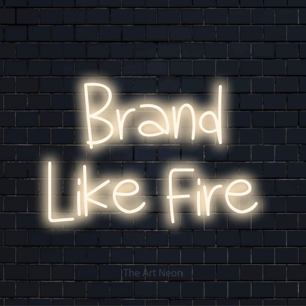 "Brand Like Fire" LED neon sign on a black brick wall