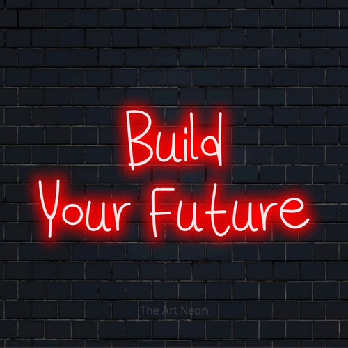 "Build Your Future" glowing LED neon sign on a black brick wall