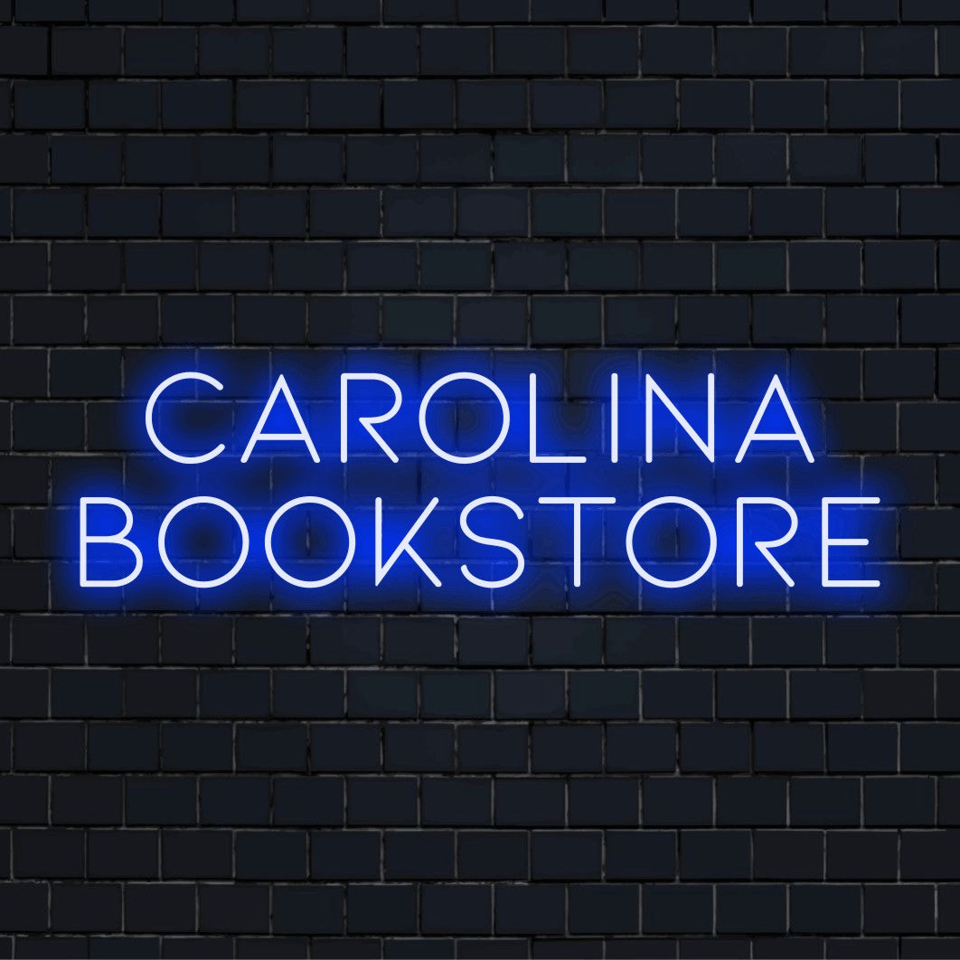Carolina Bookstore Custom Name Neon Sign, bright neon lettering on black brick background