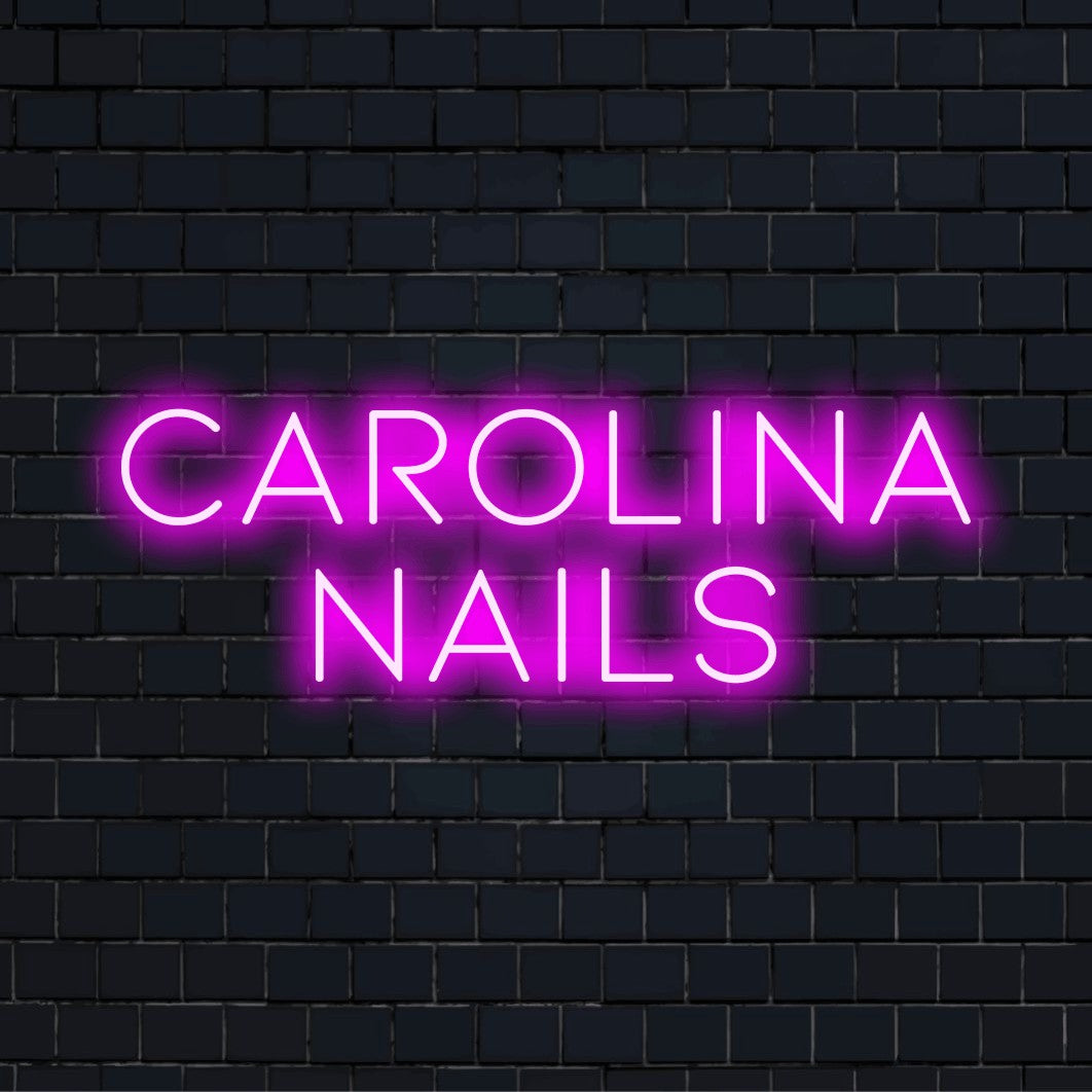 Carolina Nails Custom Name Neon Sign, glowing neon text against brick backdrop