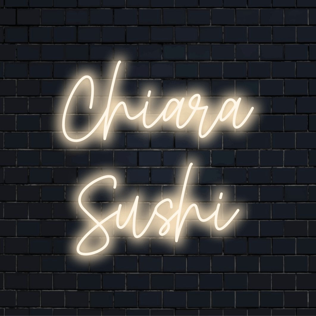 Chiara Sushi Custom Name Neon Sign, bright neon lettering against black brick wall