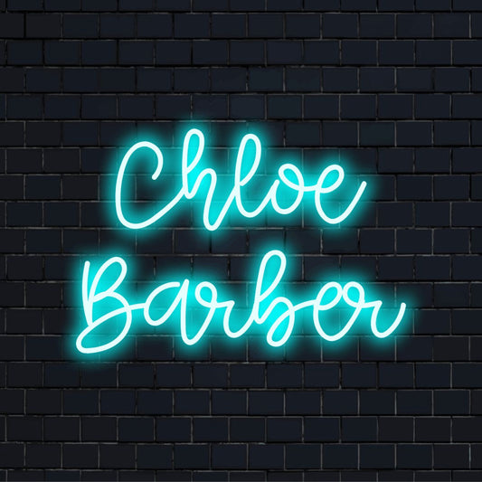 Chloe Barber Personalized Neon Light with glowing lettering on black brick background