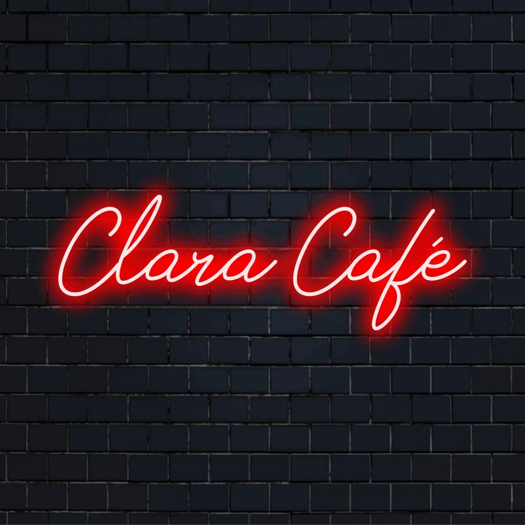 Clara Cafe Custom Name Neon Sign, bright LED glow against black brick wall