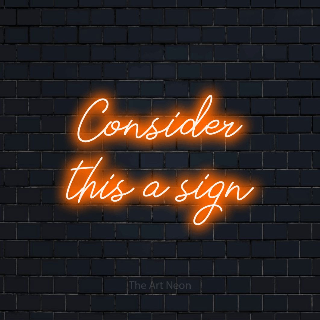 "Consider This A Sign" LED neon sign on a black brick wall