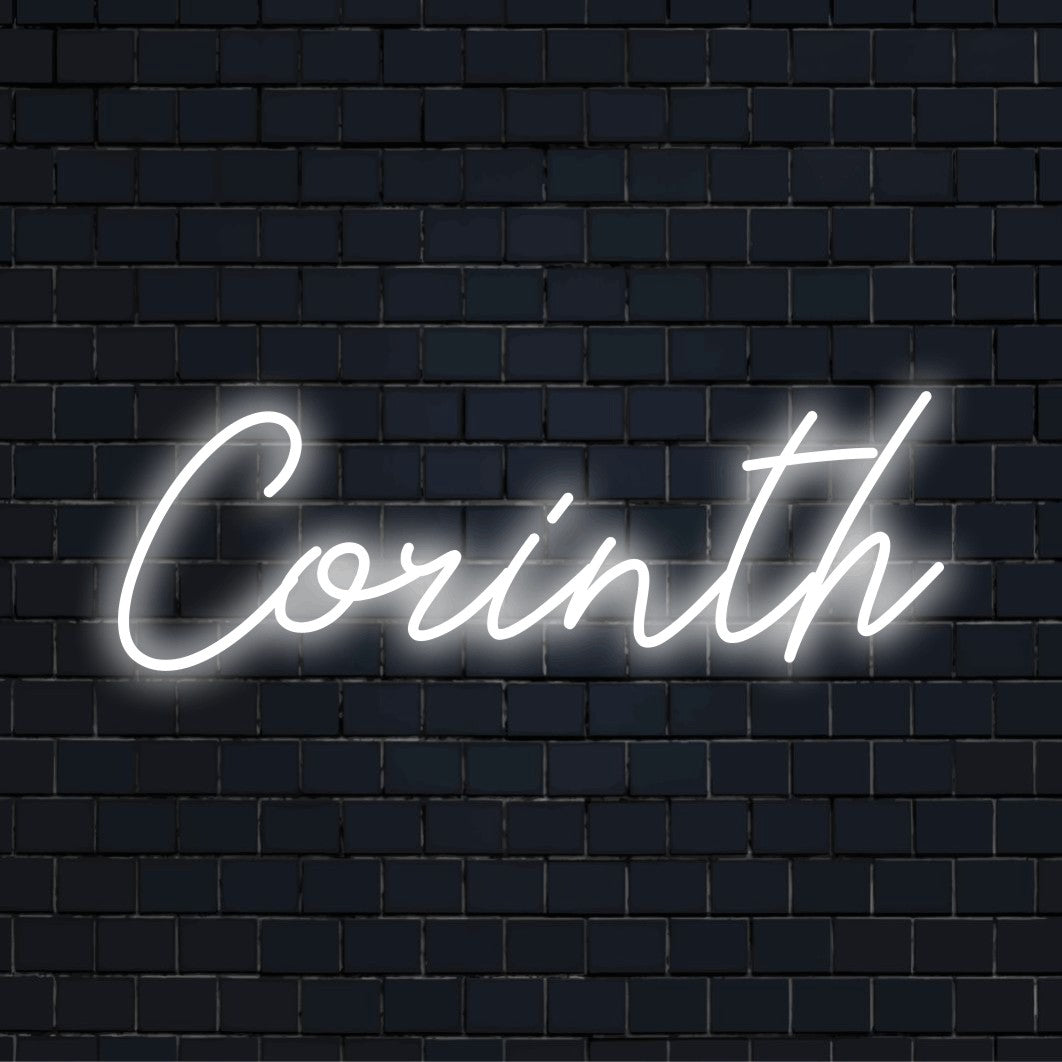Corinth Neon Sign, bright LED glow against brick backdrop