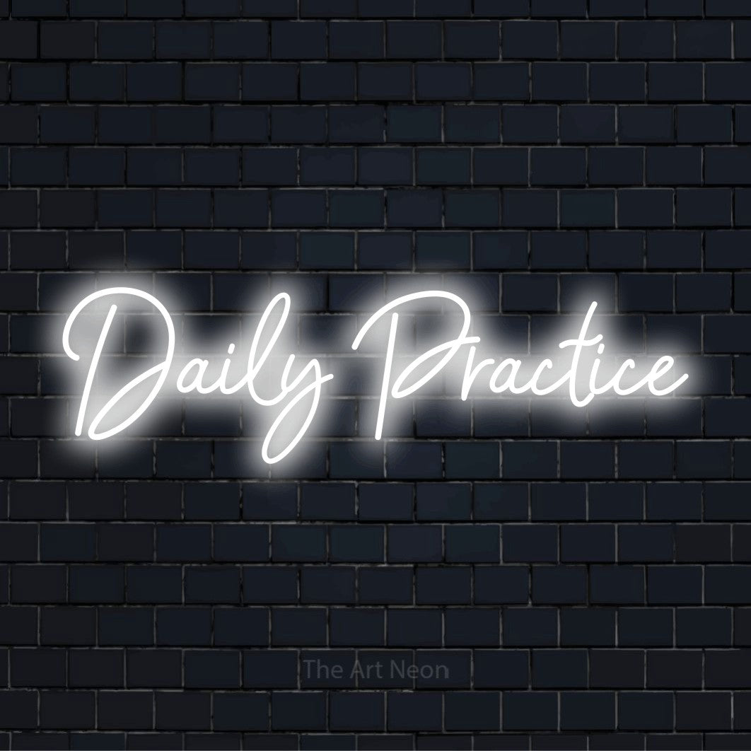 "Daily Practice" script-style LED neon sign on a black brick wall