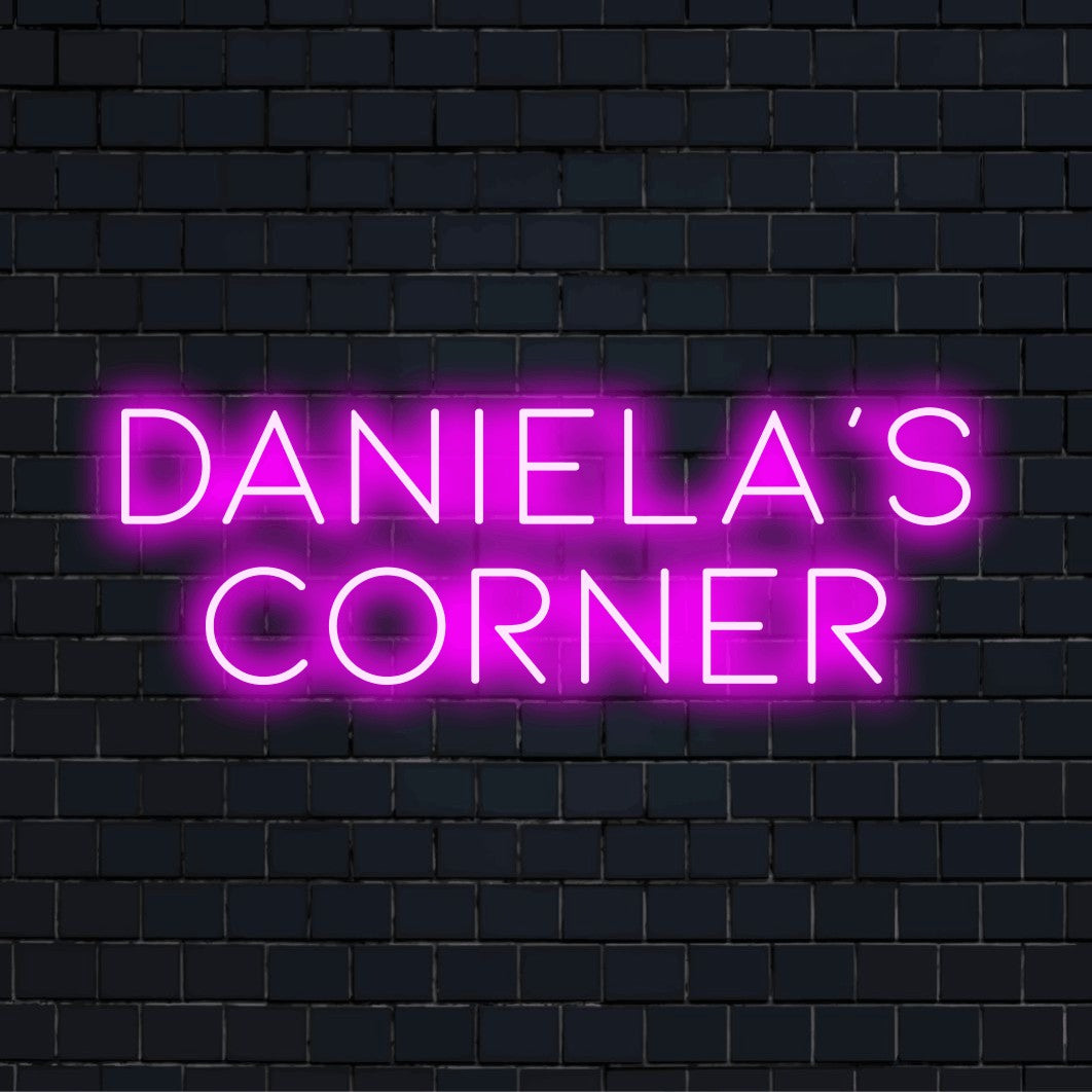 Daniela_s Corner Personalized Neon Light with bright neon lettering on dark brick background