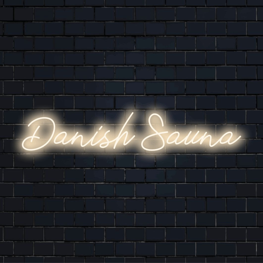 Danish Sauna Neon Light with glowing neon text on dark brick background