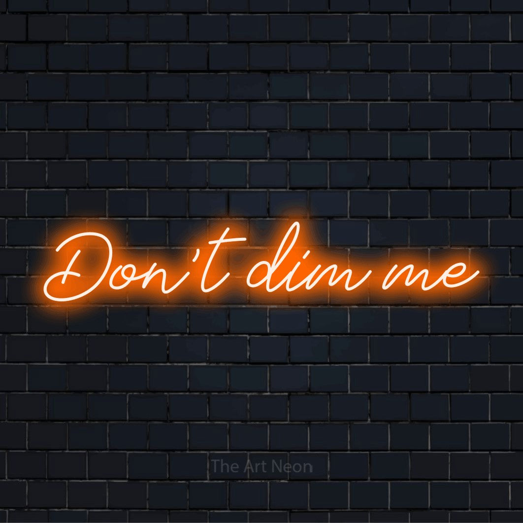 "Don’t Dim Me" text design with neon effect on a black brick wall