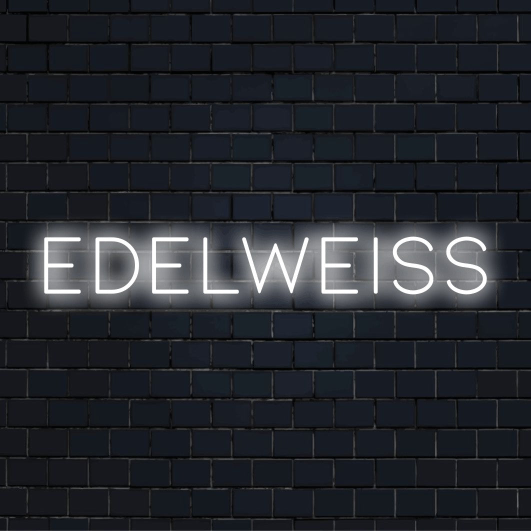Edelweiss LED Neon Sign, bright neon lettering on black brick background
