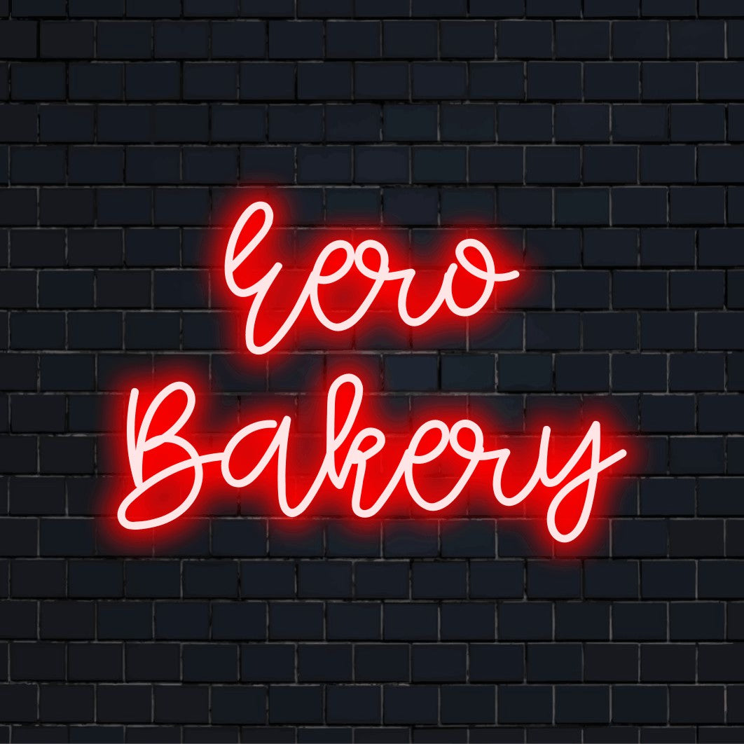 Eero Bakery Custom Name Neon Sign, glowing lettering against brick backdrop