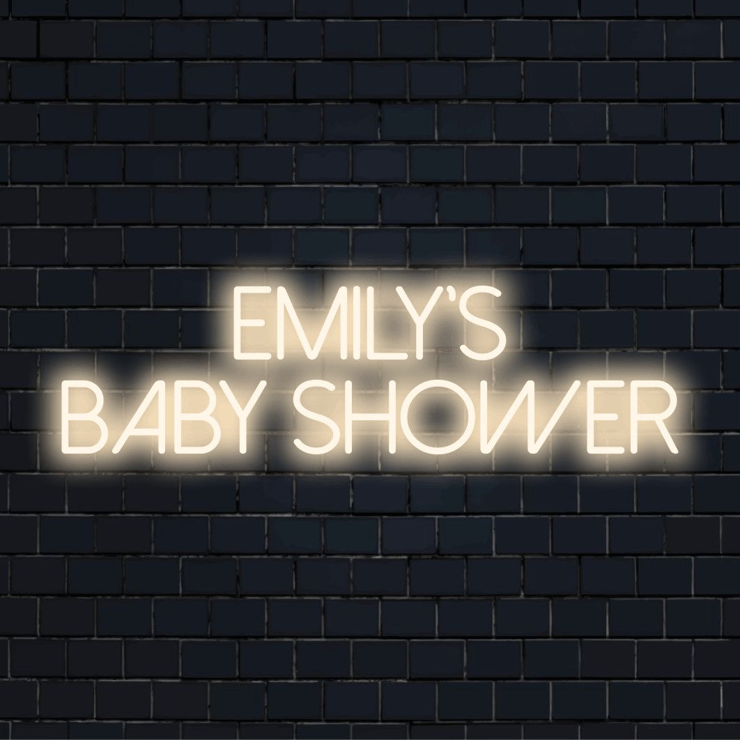 Emily_s Baby Shower Custom Name Neon Sign, bright LED glow against black brick wall
