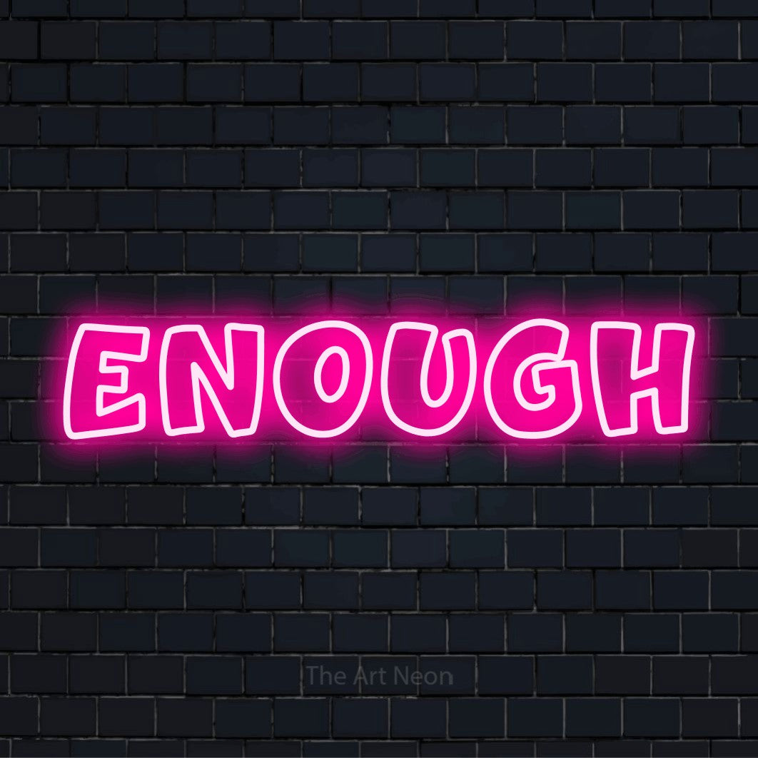 "Enough" glowing LED neon sign on a black brick wall