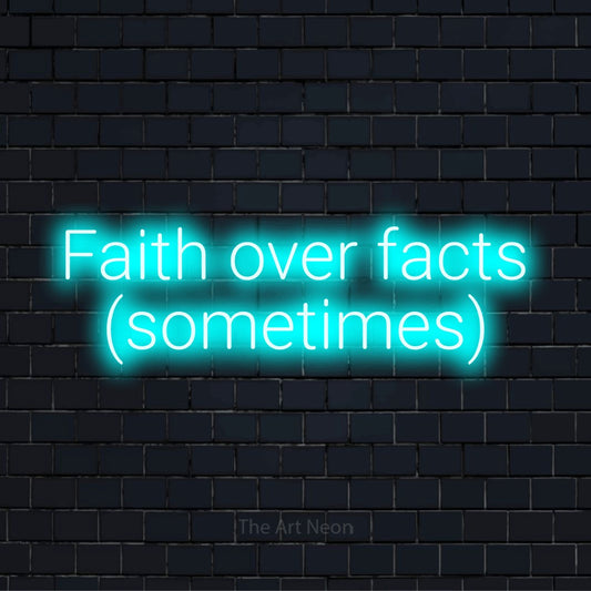 "Faith Over Facts (sometimes)" text design with neon effect on a black brick wall