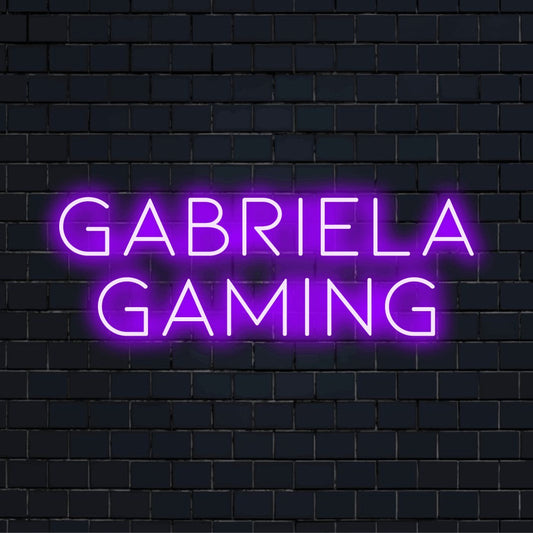 Gabriela Gaming Personalized Neon Light with bright LED glow against black brick wall