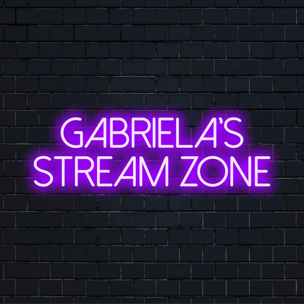 Gabriela_s Stream Zone Personalized Neon Light with neon text light against black brick wall