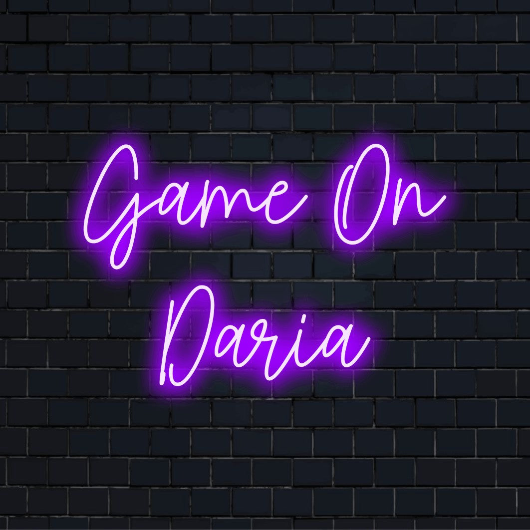 Game On Daria Custom Name Neon Sign, bright LED glow against black brick wall