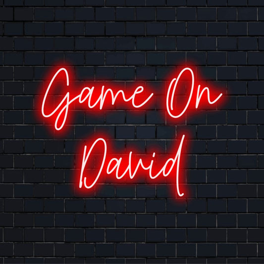 Game On David Custom Name Neon Sign, glowing neon text on black brick background