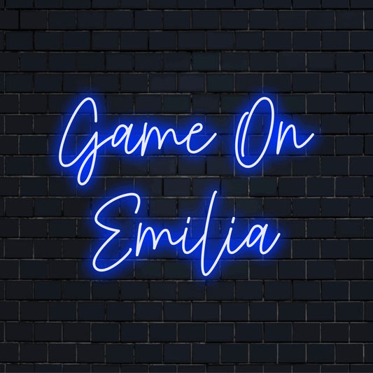 Game On Emilia Custom Name Neon Sign, glowing neon text against brick backdrop