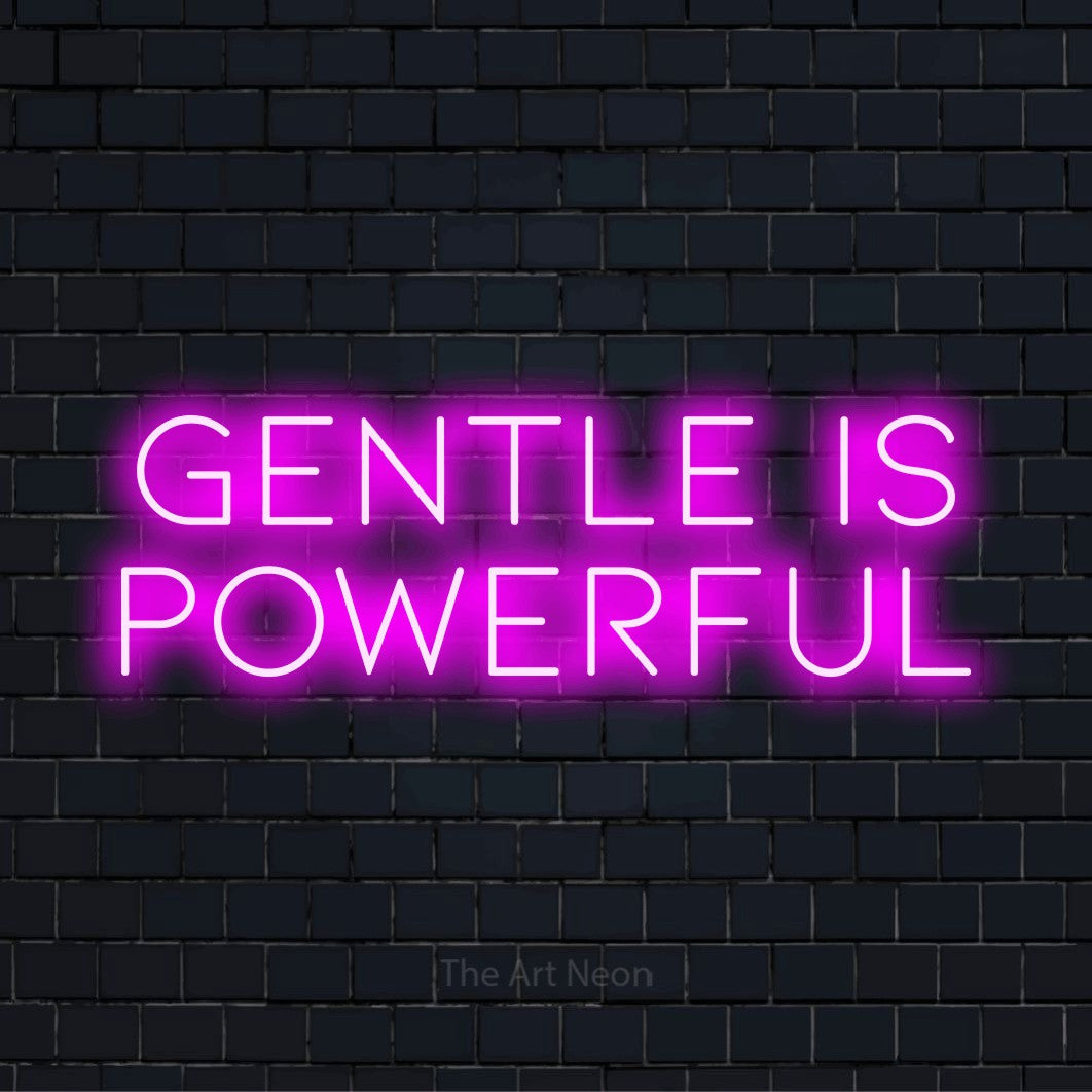 "Gentle Is Powerful" text design with neon effect on a black brick wall