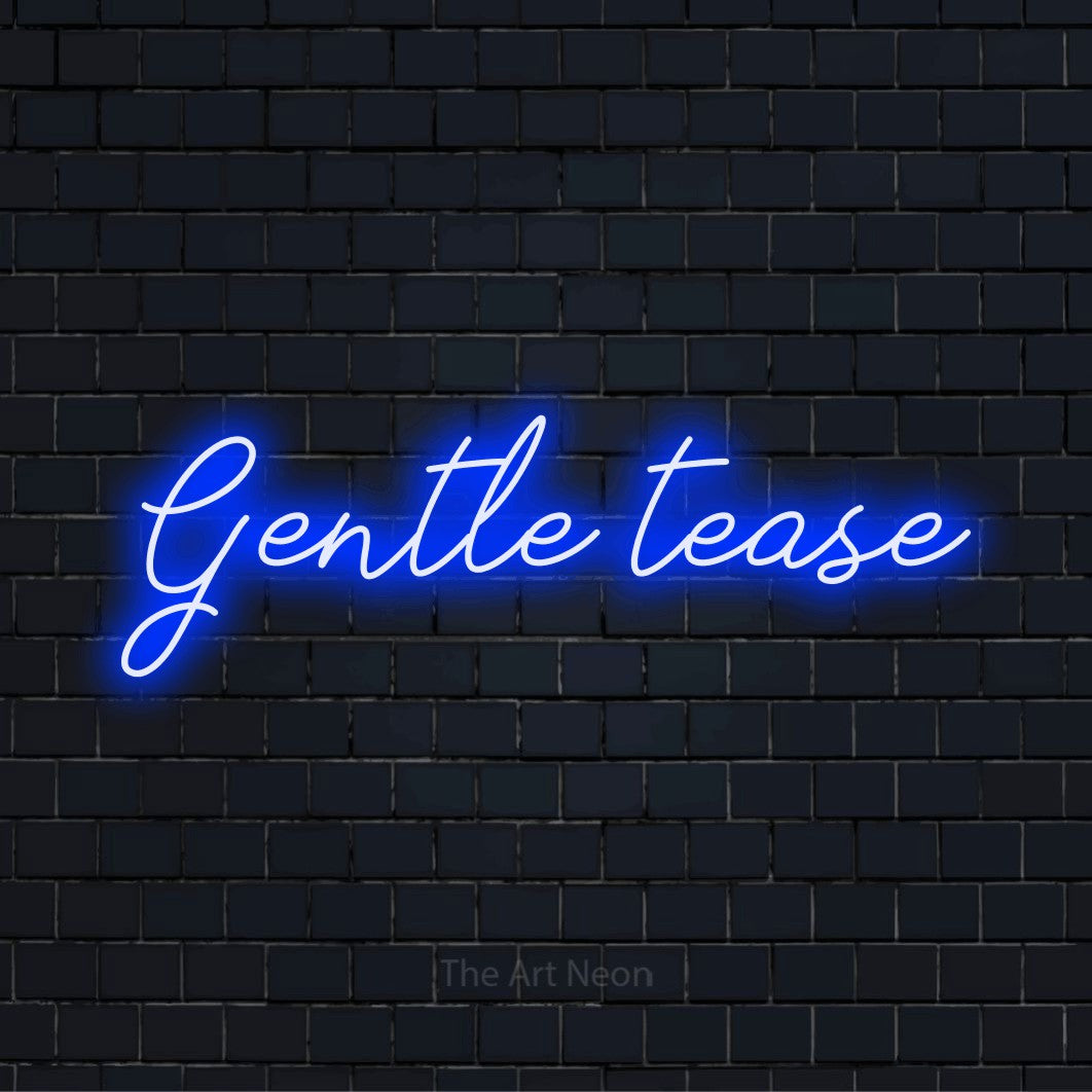 "Gentle Tease" script-style LED neon sign on a black brick wall