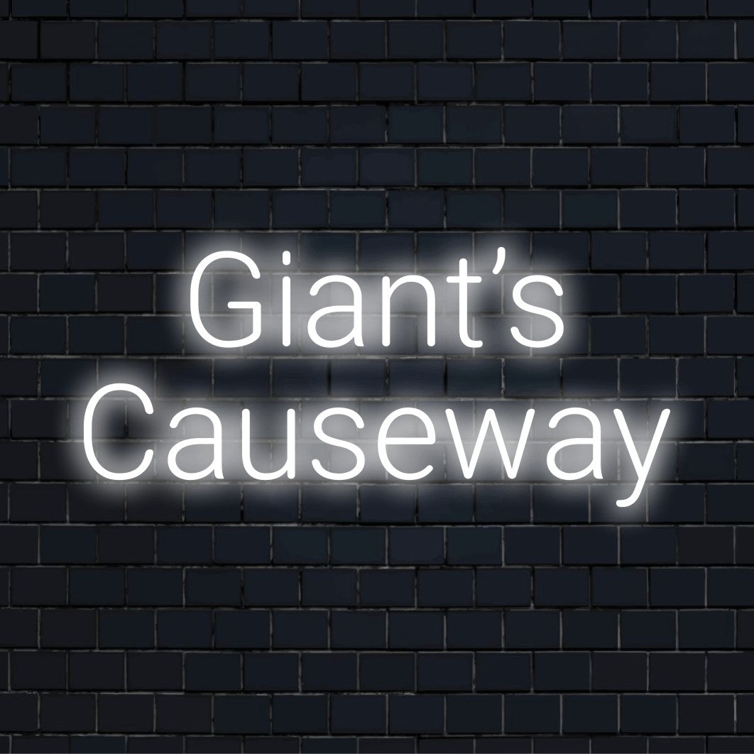 Giant S Causeway Neon Sign, glowing wall decor on dark brick wall