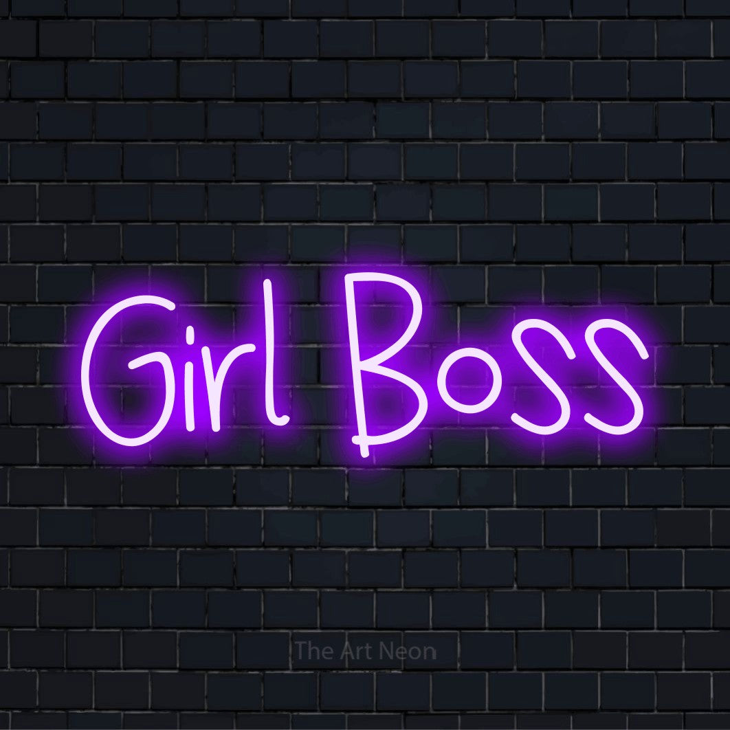 "Girl Boss" glowing LED neon sign on a black brick wall