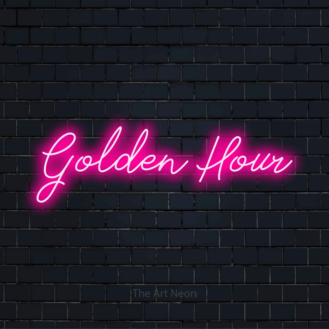"Golden Hour" neon text design on a black brick wall
