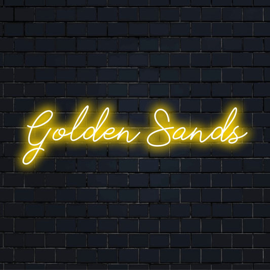 Golden Sands Neon Light with glowing neon text on dark brick background