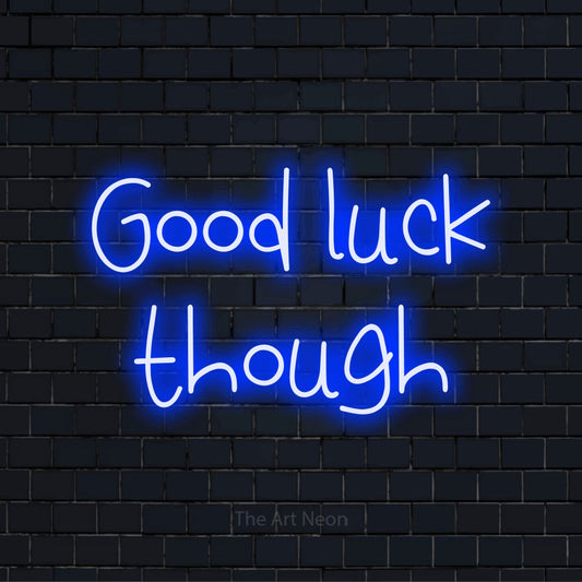 "Good Luck Though" script-style LED neon sign on a black brick wall