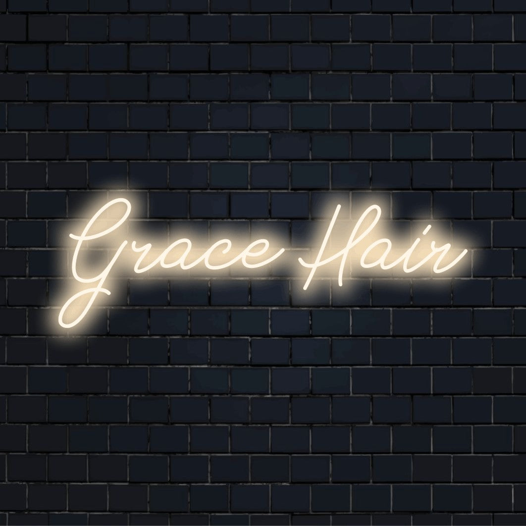 Grace Hair Personalized LED Neon Sign, glowing neon text against brick backdrop