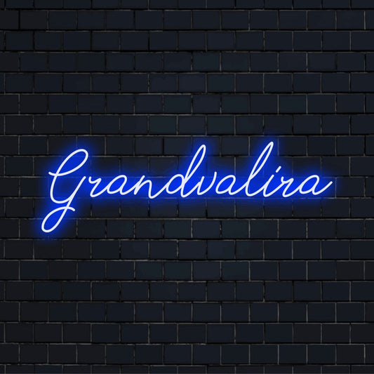 Grandvalira Neon Light with bright neon glow against black brick wall