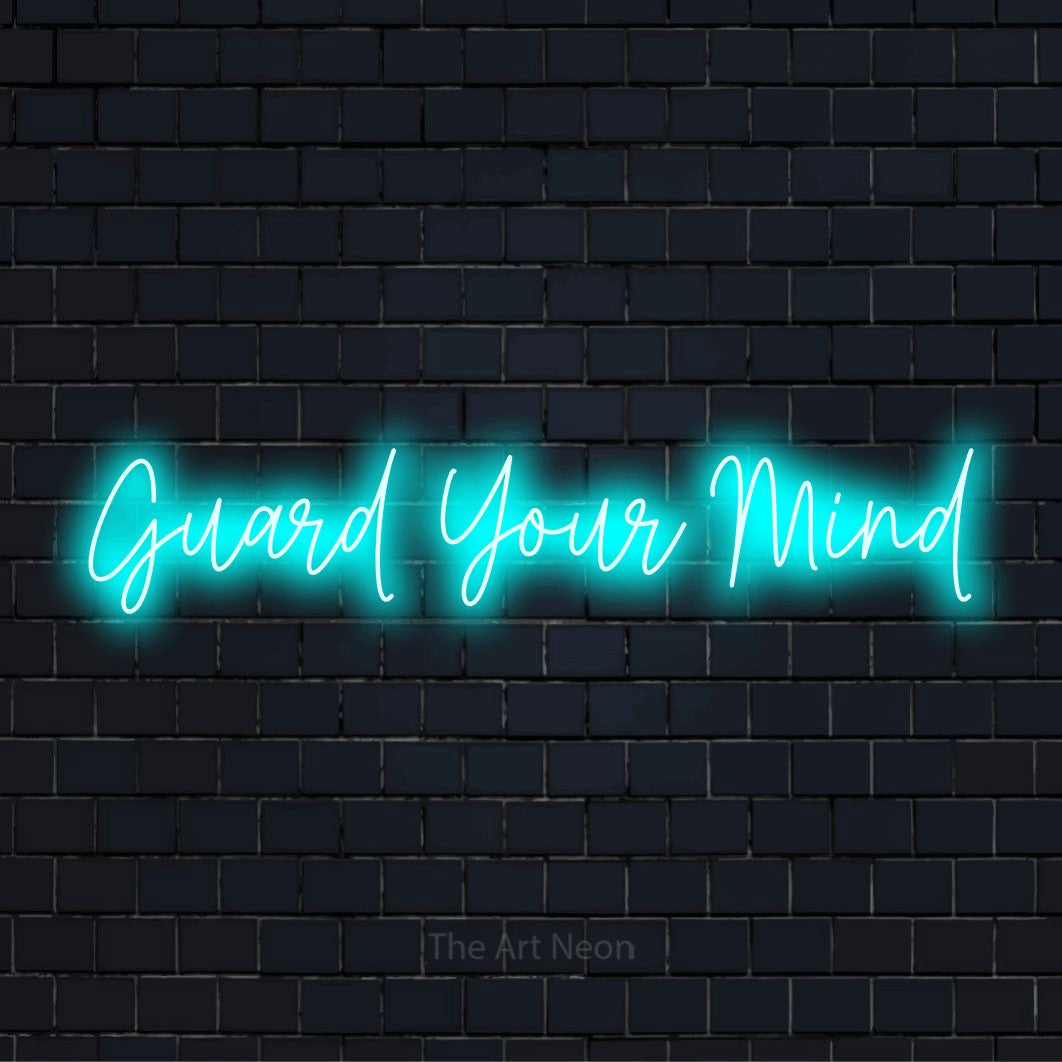 "Guard Your Mind" text design with neon effect on a black brick wall