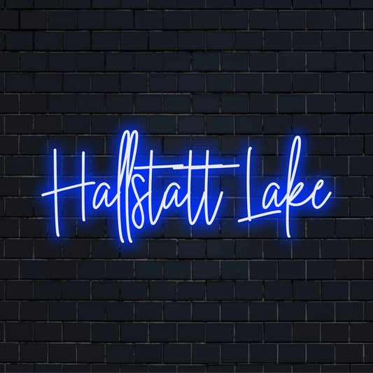 Hallstatt Lake LED Neon Sign, glowing lettering against black brick wall