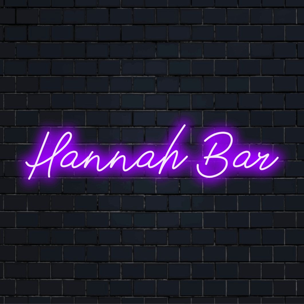 Hannah Bar Personalized Neon Light with glowing neon text on dark brick background