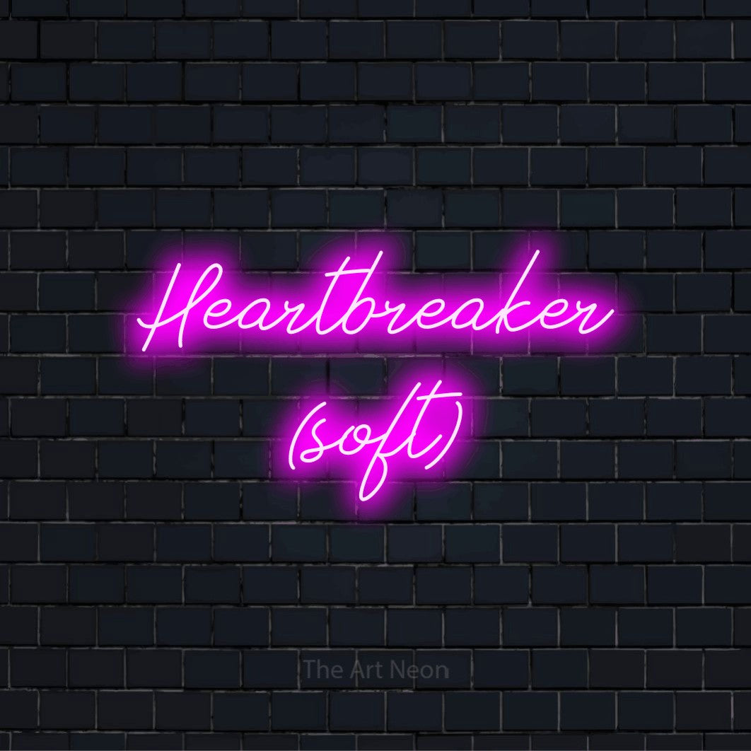 "Heartbreaker (soft)" text design with neon effect on a black brick wall