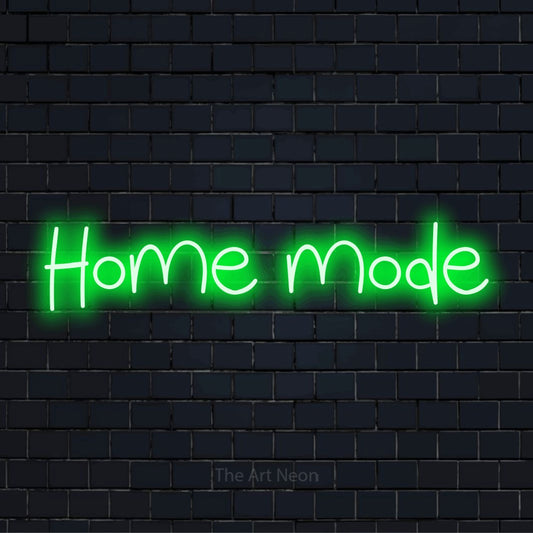 "Home Mode" script-style LED neon sign on a black brick wall