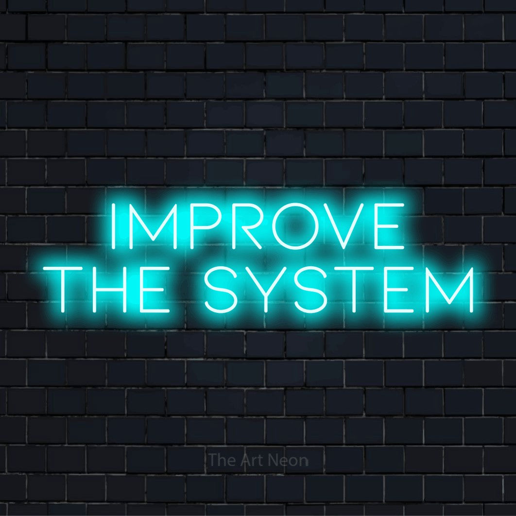 "Improve The System" glowing LED neon sign on a black brick wall