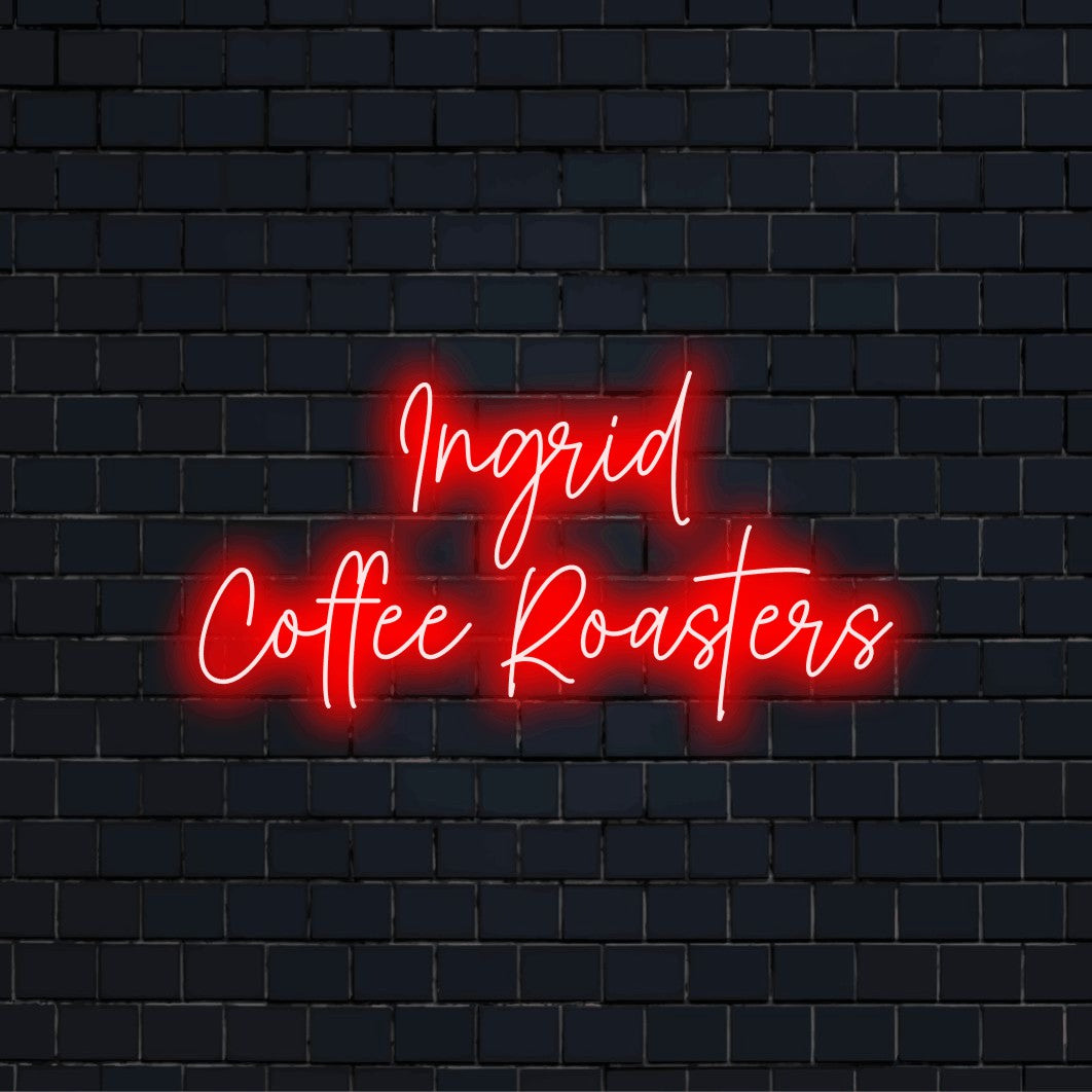 Ingrid Coffee Roasters Custom Name Neon Sign, glowing neon text against brick backdrop