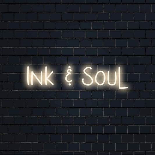 Ink Soul Neon Sign, bright neon glow against black brick wall